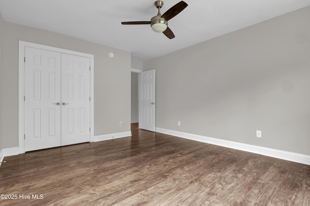 1113 Foxbow Cv, Leland, NC 28451 - unfurnished bedroom featuring wood finished floors, a closet, baseboards, and ceiling fan