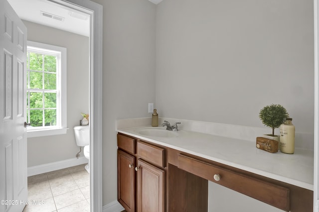 1113 Foxbow Cv, Leland, NC 28451 - bathroom with toilet, vanity, tile patterned floors, and plenty of natural light