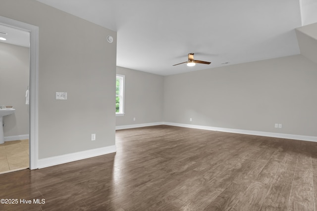 1113 Foxbow Cv, Leland, NC 28451 - spare room featuring ceiling fan, wood finished floors, and baseboards