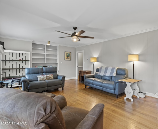 405 E Westbrook St, Wallace, NC 28466 - living area featuring ceiling fan, wood finished floors, built in features, ornamental molding, and baseboards