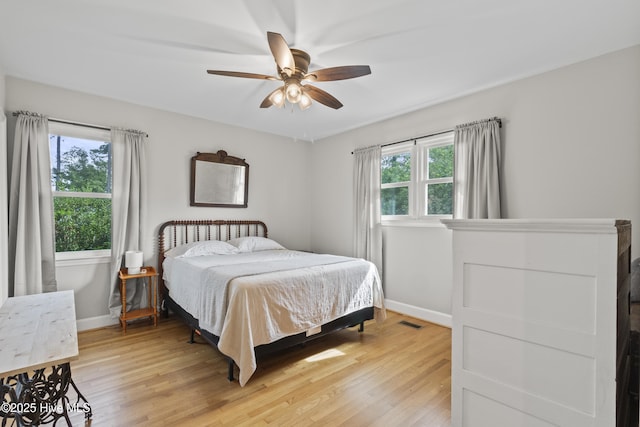 405 E Westbrook St, Wallace, NC 28466 - bedroom featuring baseboards, light wood-style floors, and ceiling fan