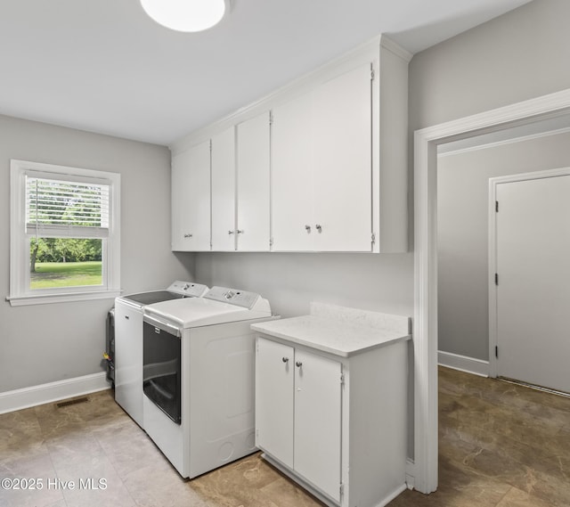 405 E Westbrook St, Wallace, NC 28466 - laundry room featuring cabinet space, independent washer and dryer, and baseboards