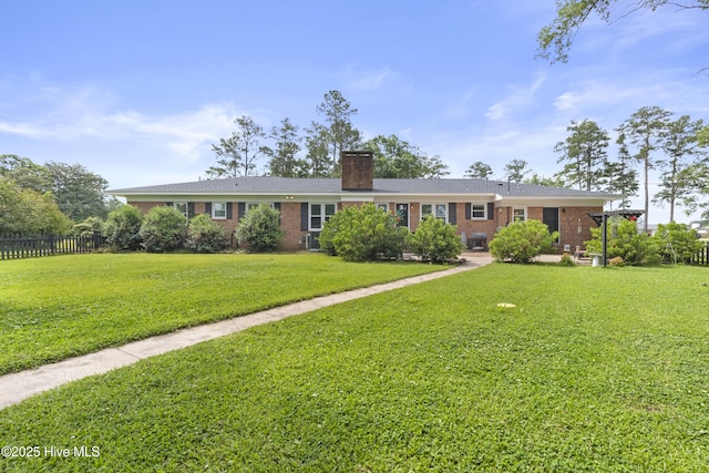 405 E Westbrook St, Wallace, NC 28466 - ranch-style house with brick siding and a chimney
