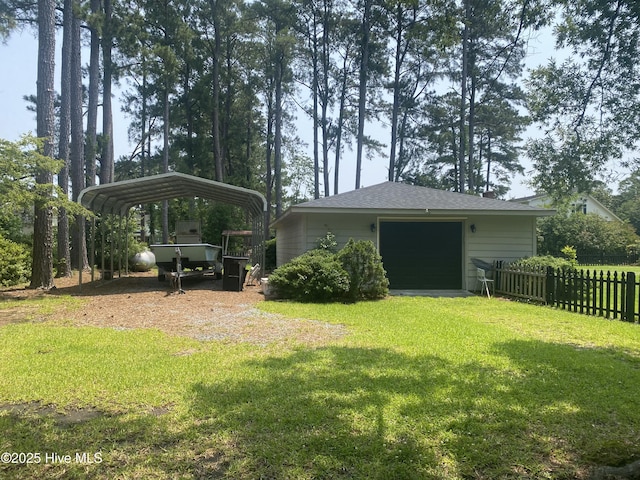 405 E Westbrook St, Wallace, NC 28466 - view of yard featuring a detached carport, driveway, and a garage
