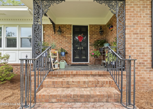 405 E Westbrook St, Wallace, NC 28466 - property entrance featuring a porch and brick siding