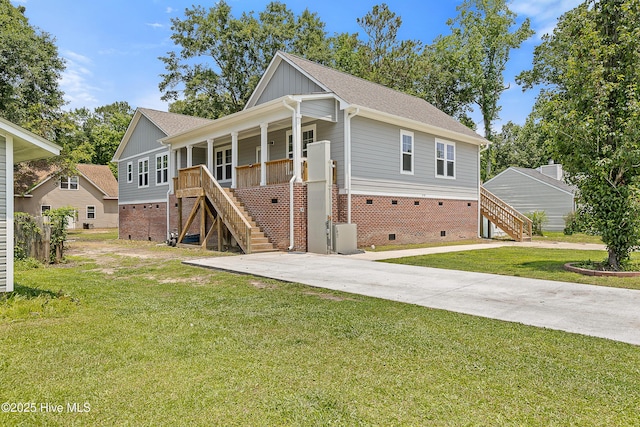 218 Spring Dr, Jacksonville, NC 28540 - rear view of property with stairs, crawl space, covered porch, and a lawn