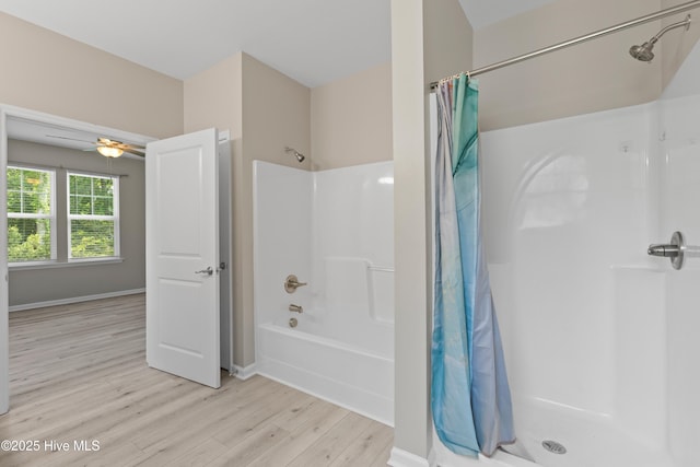 218 Spring Dr, Jacksonville, NC 28540 - bathroom featuring wood finished floors, shower / bath combo, ceiling fan, and baseboards