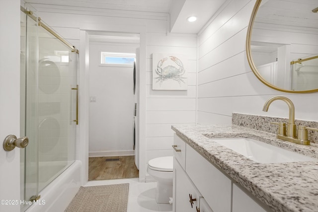 202 E 2nd St, Ocean Isle Beach, NC 28469 - bathroom with vanity, toilet, recessed lighting, and enclosed tub / shower combo