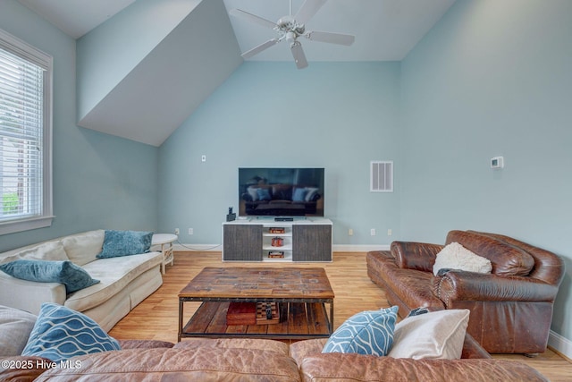 5908 Turnstone Ct, Wilmington, NC 28409 - living area featuring wood finished floors, ceiling fan, baseboards, and vaulted ceiling