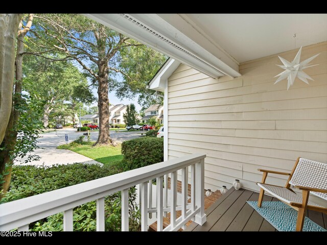 316 Wimbledon Ct, Wilmington, NC 28412 - hall featuring light carpet, a textured ceiling, and baseboards