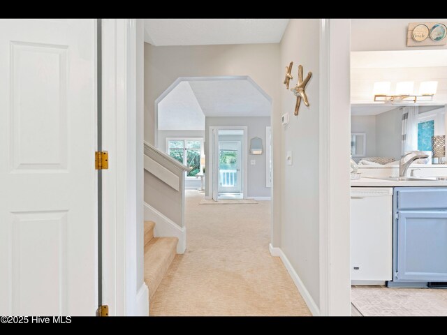 316 Wimbledon Ct, Wilmington, NC 28412 - living area featuring light carpet, baseboards, a textured ceiling, and high vaulted ceiling