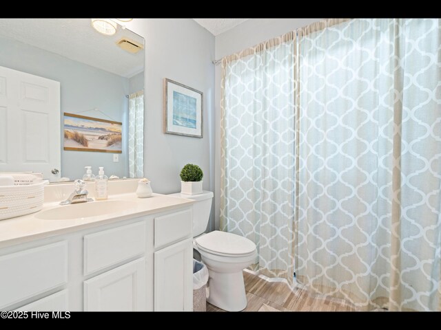316 Wimbledon Ct, Wilmington, NC 28412 - living area with arched walkways, light carpet, baseboards, recessed lighting, and plenty of natural light