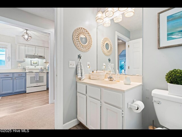 316 Wimbledon Ct, Wilmington, NC 28412 - unfurnished dining area with baseboards, carpet flooring, plenty of natural light, and a textured ceiling