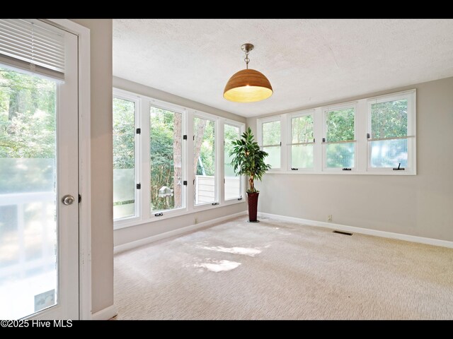 316 Wimbledon Ct, Wilmington, NC 28412 - hall with light colored carpet, a textured ceiling, and baseboards