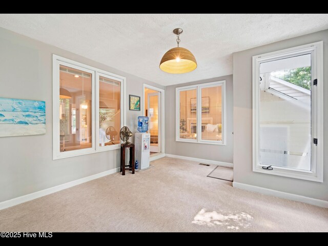 316 Wimbledon Ct, Wilmington, NC 28412 - corridor featuring a textured ceiling, an upstairs landing, lofted ceiling, carpet flooring, and baseboards