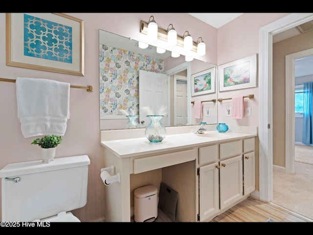 316 Wimbledon Ct, Wilmington, NC 28412 - bathroom featuring toilet, vanity, and baseboards