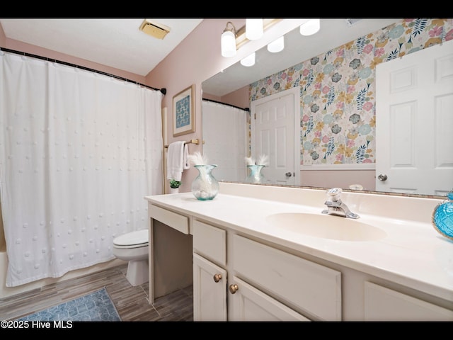 316 Wimbledon Ct, Wilmington, NC 28412 - bathroom with vanity, toilet, and wallpapered walls