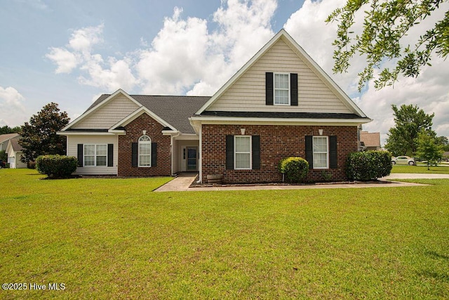 127 Moonstone Ct, Jacksonville, NC 28546 - traditional-style house featuring brick siding and a front yard
