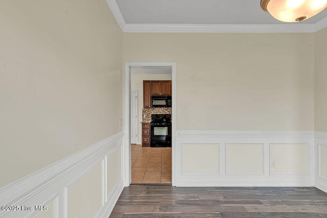 127 Moonstone Ct, Jacksonville, NC 28546 - unfurnished room featuring dark wood-style flooring, crown molding, and wainscoting