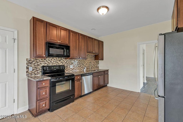 127 Moonstone Ct, Jacksonville, NC 28546 - kitchen with black appliances, stone countertops, tasteful backsplash, light tile patterned floors, and a sink