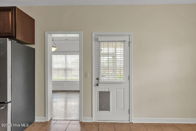 127 Moonstone Ct, Jacksonville, NC 28546 - doorway to outside featuring baseboards and tile patterned flooring
