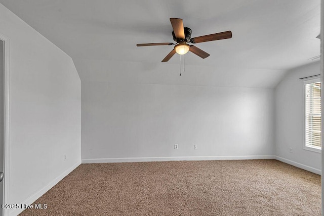 127 Moonstone Ct, Jacksonville, NC 28546 - spare room featuring lofted ceiling, carpet flooring, ceiling fan, and baseboards