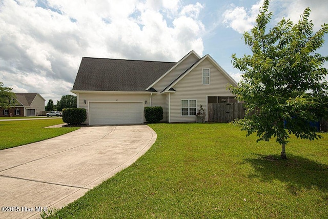 127 Moonstone Ct, Jacksonville, NC 28546 - traditional home with driveway, an attached garage, and a front lawn