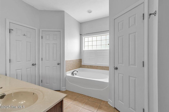 127 Moonstone Ct, Jacksonville, NC 28546 - bathroom featuring tile patterned floors, a bath, and double vanity
