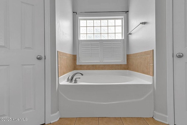 127 Moonstone Ct, Jacksonville, NC 28546 - bathroom with a garden tub and tile patterned flooring