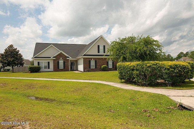 127 Moonstone Ct, Jacksonville, NC 28546 - traditional-style home with a front yard and brick siding