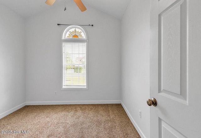 127 Moonstone Ct, Jacksonville, NC 28546 - spare room featuring carpet floors, vaulted ceiling, ceiling fan, and baseboards
