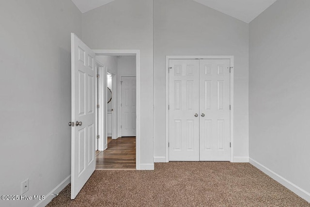 127 Moonstone Ct, Jacksonville, NC 28546 - unfurnished bedroom featuring lofted ceiling, carpet, baseboards, and a closet