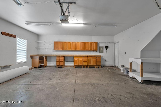 127 Moonstone Ct, Jacksonville, NC 28546 - garage featuring a garage door opener and electric panel