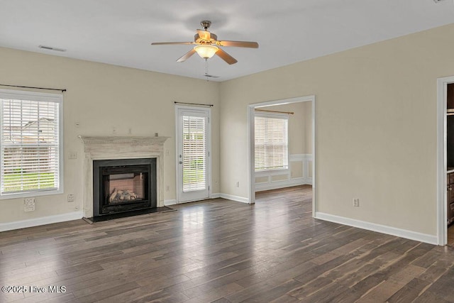 127 Moonstone Ct, Jacksonville, NC 28546 - unfurnished living room featuring ceiling fan, plenty of natural light, a fireplace, and dark wood finished floors