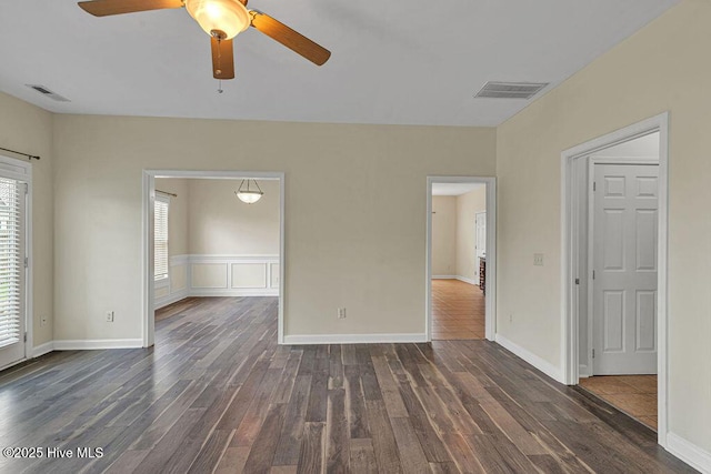 127 Moonstone Ct, Jacksonville, NC 28546 - spare room featuring dark wood finished floors and a ceiling fan