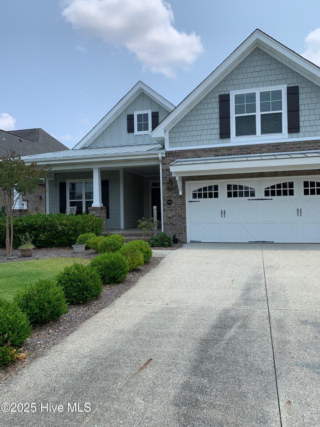 2316 Foundry Ct, Wilmington, NC 28412 - craftsman inspired home featuring board and batten siding, concrete driveway, a garage, and covered porch