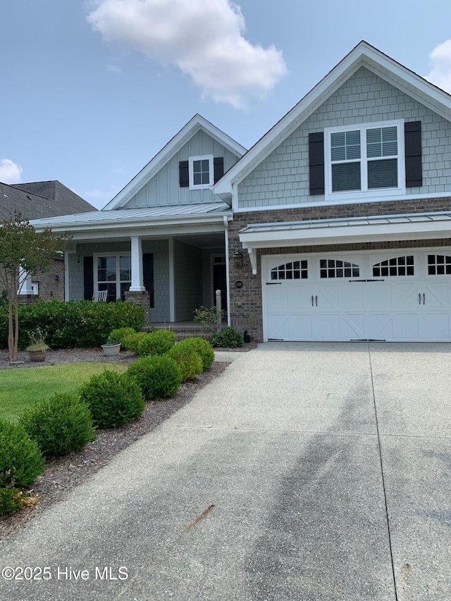 2316 Foundry Ct, Wilmington, NC 28412 - craftsman inspired home featuring board and batten siding, concrete driveway, a garage, and covered porch