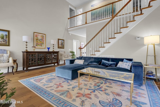 2122 Airlie Brook Dr, Wilmington, NC 28403 - living room with a high ceiling, stairs, and wood finished floors