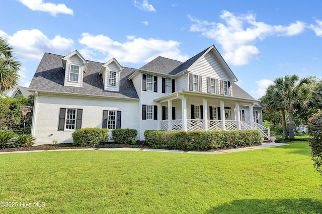 2122 Airlie Brook Dr, Wilmington, NC 28403 - view of front of home with a porch, a front yard, brick siding, and roof with shingles