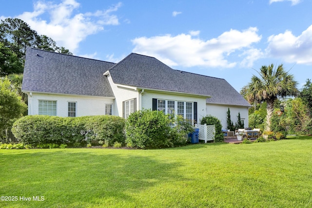 2122 Airlie Brook Dr, Wilmington, NC 28403 - rear view of property with a yard and roof with shingles