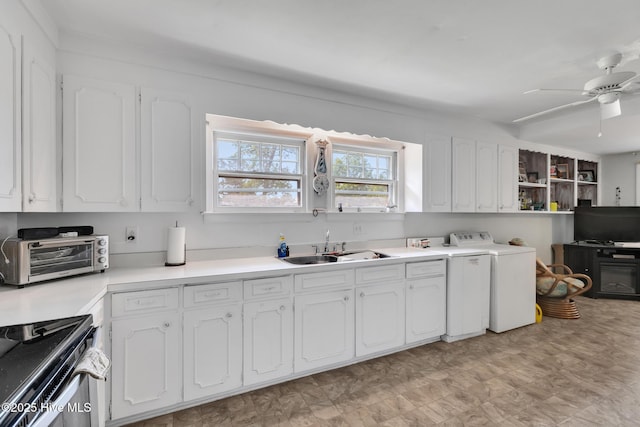 601 Mary Ann Dr, Hampstead, NC 28443 - kitchen featuring range, white cabinets, ceiling fan, light floors, and a sink