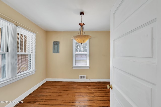 601 Mary Ann Dr, Hampstead, NC 28443 - unfurnished dining area with baseboards, wood finished floors, and electric panel