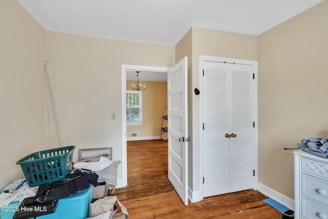 601 Mary Ann Dr, Hampstead, NC 28443 - sitting room featuring a chandelier, wood finished floors, and baseboards