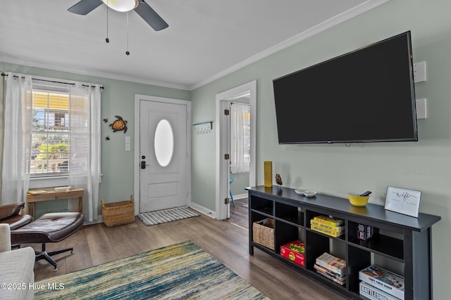 208 Hamlet Ave, Carolina Beach, NC 28428 - foyer entrance featuring ornamental molding, wood finished floors, ceiling fan, and baseboards