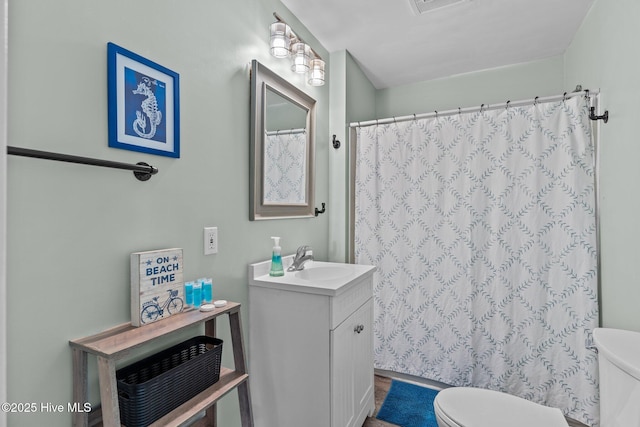 208 Hamlet Ave, Carolina Beach, NC 28428 - full bath with toilet, vanity, and a shower with shower curtain