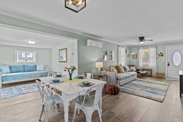 208 Hamlet Ave, Carolina Beach, NC 28428 - dining area with an AC wall unit, plenty of natural light, wood finished floors, and ornamental molding