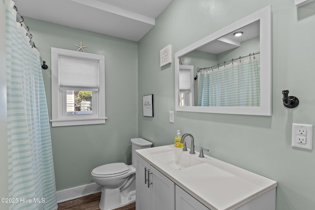 208 Hamlet Ave, Carolina Beach, NC 28428 - full bath featuring vanity, toilet, wood finished floors, and baseboards