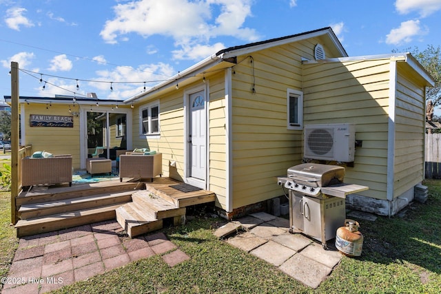 208 Hamlet Ave, Carolina Beach, NC 28428 - back of house with a cooling unit