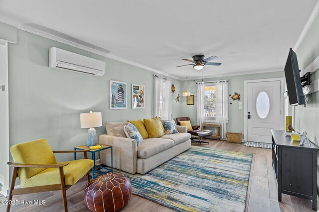 208 Hamlet Ave, Carolina Beach, NC 28428 - living room with a wall mounted AC, crown molding, ceiling fan, and wood finished floors