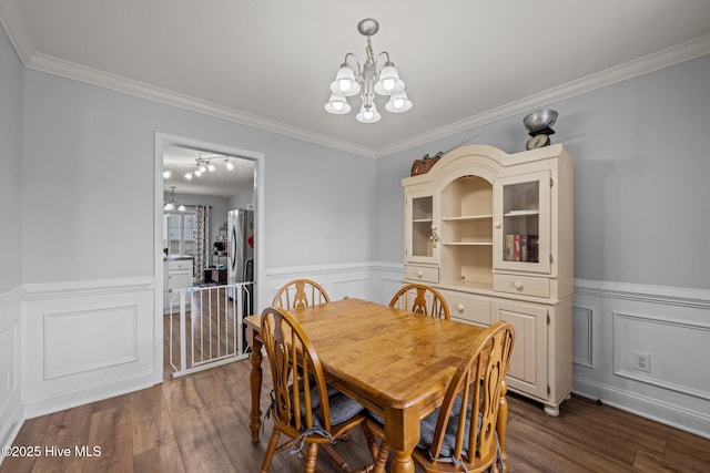 2902 Brems Battery, New Bern, NC 28562 - dining space with a chandelier, a wainscoted wall, dark wood-type flooring, and crown molding